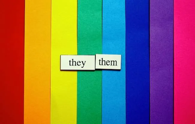 they them words on a rainbow background
