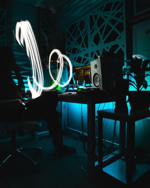 cool image of a at home music studio with a light effect coming from the speaker